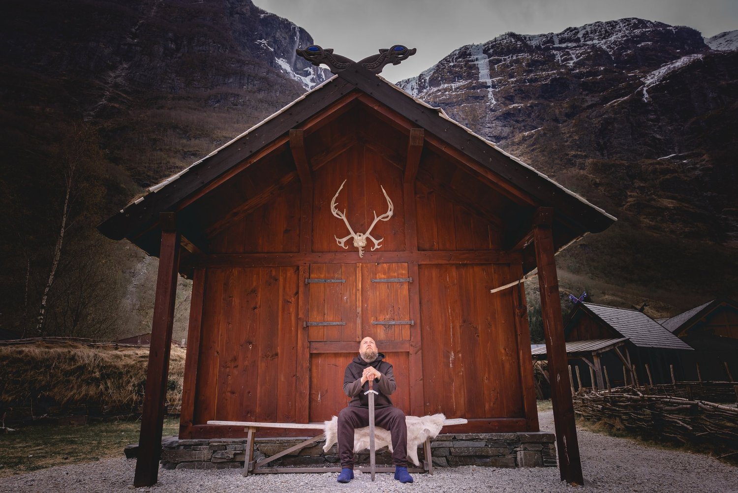 Timber longhouse lodging beside the fjord at Gudvangen